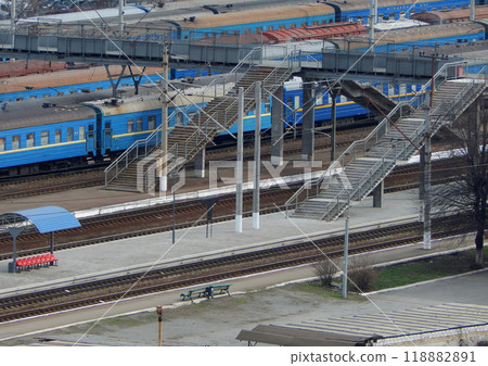 Small railway station with passenger train cars on the tracks aerial stock photo Small railway station with passenger train cars on the tracks aerial stock photo 118882891