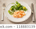 Shrimp poached in coconut oil, served with greens and Brussels sprouts 118883139