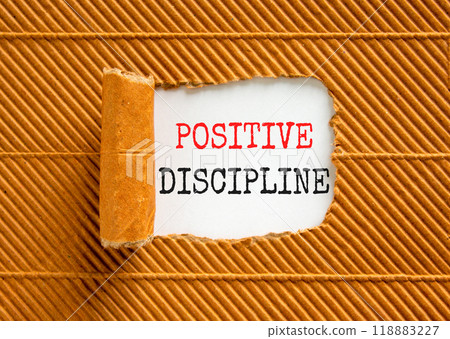Positive discipline symbol. Concept words Positive discipline on beautiful white paper. Beautiful brown paper background. Business psychology positive discipline concept. Copy space. Positive discipline symbol. Concept words Positive discipline on beautiful white paper. Beautiful brown paper background. Business psychology positive discipline concept. Copy space. 118883227