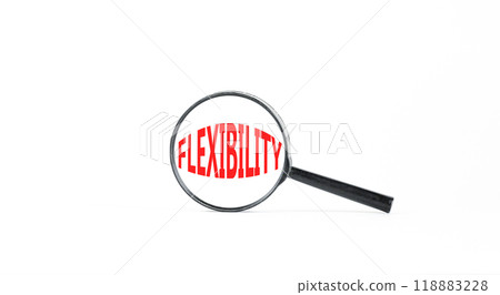 Flexibility symbol. Concept word Flexibility in beautiful magnifying glass. Beautiful white paper background. Business flexibility concept. Copy space. 118883228