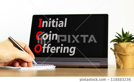 ICO initial coin offering symbol. Concept words ICO initial coin offering on beautiful black tablet. Beautiful white background. Businessman hand. Business ICO initial coin offering concept Copy space ICO initial coin offering symbol. Concept words ICO initial coin offering on beautiful black tablet. Beautiful white background. Businessman hand. Business ICO initial coin offering concept Copy space 118883236
