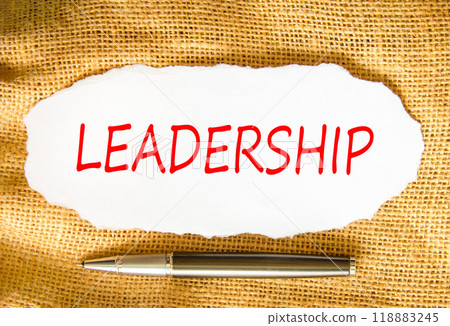Leadership symbol. Concept word Leadership on beautiful white paper. Beautiful canvas background. Beautiful black pen. Business leadership concept. Copy space. Leadership symbol. Concept word Leadership on beautiful white paper. Beautiful canvas background. Beautiful black pen. Business leadership concept. Copy space. 118883245