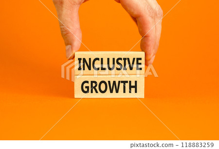 Inclusive growth symbol. Concept words Inclusive growth on beautiful wooden blocks. Beautiful orange table orange background. Businessman hand. Business inclusive growth concept. Copy space. Inclusive growth symbol. Concept words Inclusive growth on beautiful wooden blocks. Beautiful orange table orange background. Businessman hand. Business inclusive growth concept. Copy space. 118883259