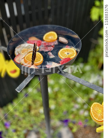 Butterfly on a plate with fresh fruit in the garden. 118883376