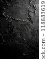 Textured black surface with unique patterns and varying depths captured in soft light. Generative AI 118883619