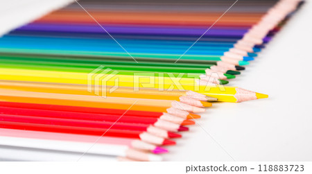 Colored pencils lying in row 118883723