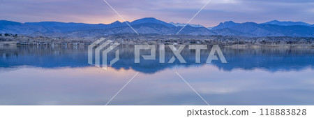 dusk over calm lake in Colorado foothills of Rocky Mountains, Boedecker Reservoir in early spring - panorama 118883828