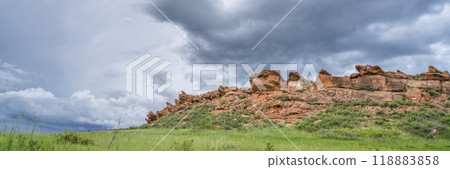 stormy clouds over sandstone cliff and green prairie in Colorado foothills - Lory State Park in late spring scenery stormy clouds over sandstone cliff and green prairie in Colorado foothills - Lory State Park in late spring scenery 118883858