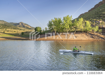 senior rower with a coastal rowing shell on Horsetooth Reservoir in northern Colorado 118883864