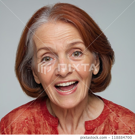 Happy Elderly Woman with Red Hair: Smiling Senior Lady Expressing Joy and Positivity 118884700
