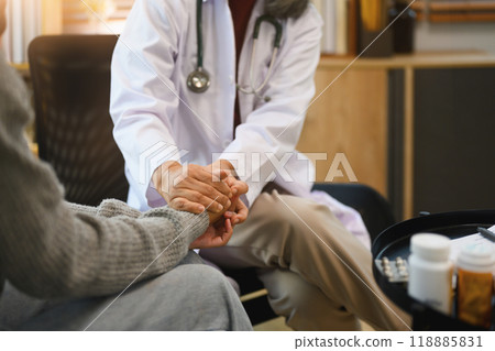 Psychiatrist gently holding patient hands. Supportive, trust and empathy in healthcare concept Psychiatrist gently holding patient hands. Supportive, trust and empathy in healthcare concept 118885831