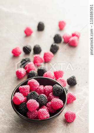 Sweet jelly candies in bowl on kitchen table Sweet jelly candies in bowl on kitchen table 118886561