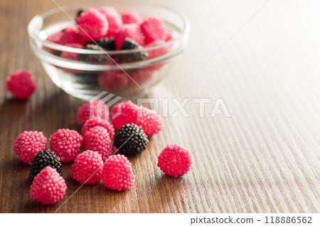 Sweet jelly candies on wooden table. Sweet jelly candies on wooden table. 118886562