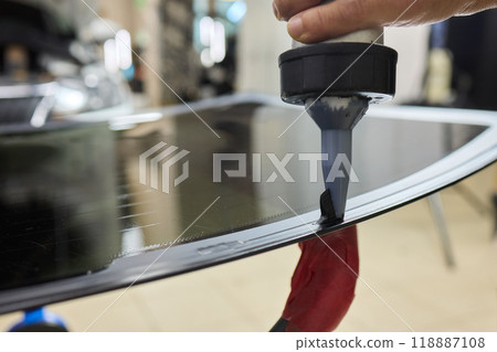 Installing windshield on a car with automotive design Installing windshield on a car with automotive design 118887108