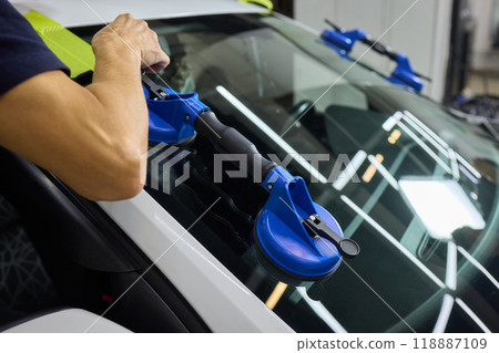 Installing windshield on a car with automotive design Installing windshield on a car with automotive design 118887109