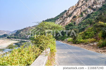 Village road through a rocky terrain Village road through a rocky terrain 118887240
