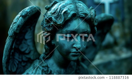 An intricately detailed blue patina angel statue stands in a cemetery, evoking a serene atmosphere amidst weathered gravestones An intricately detailed blue patina angel statue stands in a cemetery, evoking a serene atmosphere amidst weathered gravestones 118887316