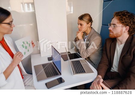 Engaging Business Meeting with Team Presentation in a Contemporary and Modern Office Space 118887628