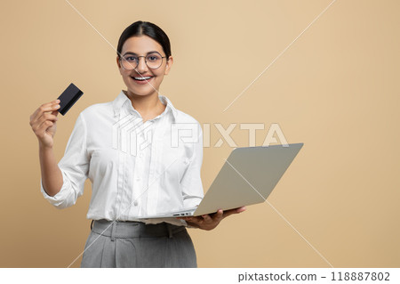 Smart woman bank client using credit card and laptop for online payment shopping transactions Smart woman bank client using credit card and laptop for online payment shopping transactions 118887802