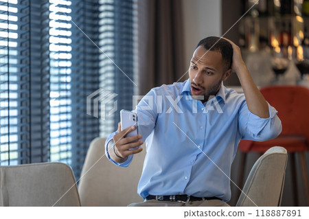 Businessman having online video communication in cafe while having break 118887891