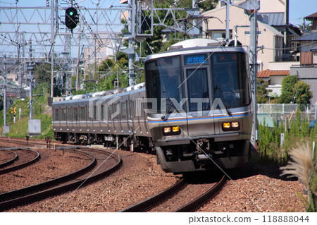 JR 223 series express train running through a large curve on the JR Kobe Line_Photo taken on September 9, 2009 118888044