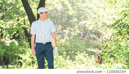 Male golfer wearing golf wear among fresh greenery (golf course, academy, membership) Male golfer wearing golf wear among fresh greenery (golf course, academy, membership) 118888284