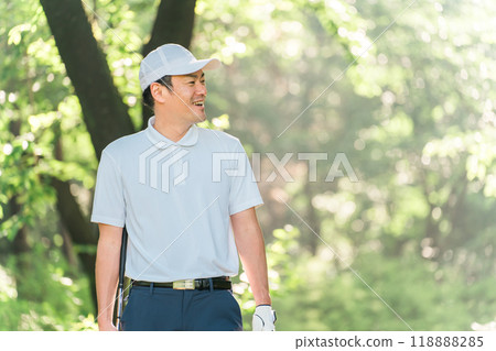 Male golfer wearing golf wear among fresh greenery (golf course, academy, membership) Male golfer wearing golf wear among fresh greenery (golf course, academy, membership) 118888285