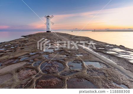 Stawa Mlyny lighthouse at sunrise, Swinoujscie, Poland 118888308
