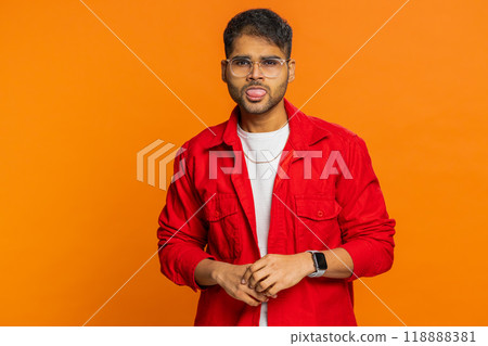 Displeased funny bully Indian man showing tongue making silly faces, fooling around, joking, teasing 118888381