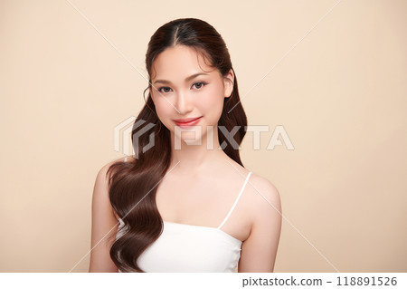 Beautiful young asian woman with clean fresh skin on beige background, Face care, Facial treatment, Cosmetology, beauty and spa, Asian women portrait. Beautiful young asian woman with clean fresh skin on beige background, Face care, Facial treatment, Cosmetology, beauty and spa, Asian women portrait. 118891526
