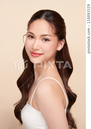 Beautiful young asian woman with clean fresh skin on beige background, Face care, Facial treatment, Cosmetology, beauty and spa, Asian women portrait. 118891529
