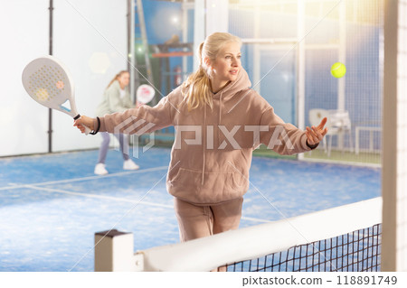 European woman playing padel European woman playing padel 118891749