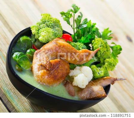 Cabbage soup with quails and greens 118891751