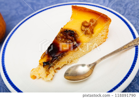 Appetizing piece of walnut pie on platter 118891790