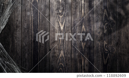 Spooky creepy cobweb spiders web covered a wooden background 118892609