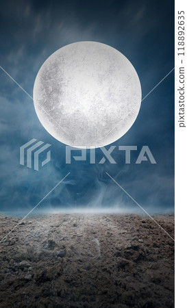Large full moon in the sky above barren landscape. Scene is dark and mysterious, with the moon casting a scary glow 118892635