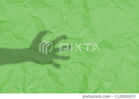 Shade of werewolf hands with fur and black claws on a green background. The hand is reaching out, and the shadow is dark. Scary claw of werewolf, wolfman, or animal monster 118892655