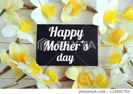 Happy Mother's Day text message decorations with flowers top view on wooden background 118892763