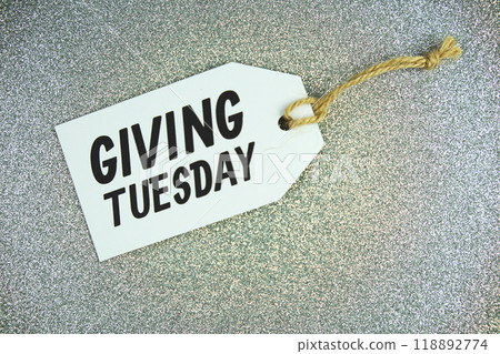 Giving Tuesday text message on paper tag with space for copy background Giving Tuesday text message on paper tag with space for copy background 118892774