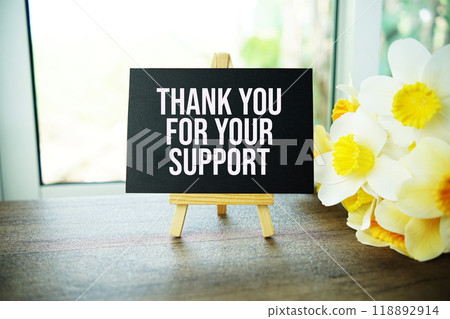 Thank You For Your Support text message with wooden easel and flower bouquet on wooden background Thank You For Your Support text message with wooden easel and flower bouquet on wooden background 118892914