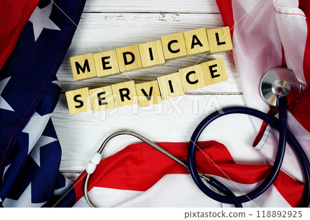 Medical Service alphabet letters with USA flag on wooden background Medical Service alphabet letters with USA flag on wooden background 118892925