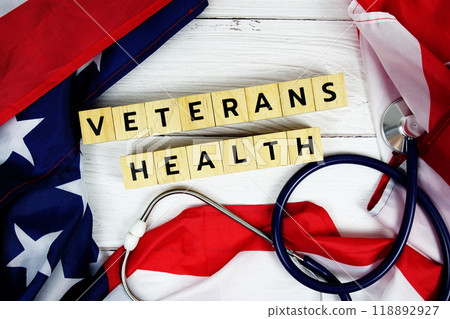 Veterans Health text messege with USA flag on wooden background Veterans Health text messege with USA flag on wooden background 118892927