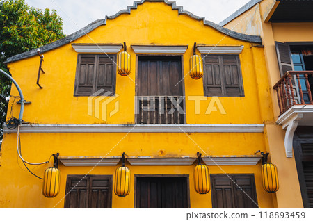 facade of Asian yellow house in old town in Hoi An in Vietnam in Asia 118893459