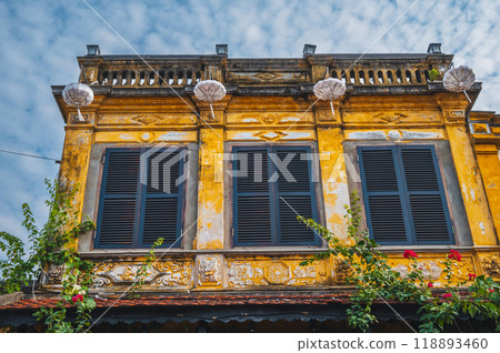 historical facade of an ancient Asian yellow house in old town in Hoi An in Vietnam in Asia in summer 118893460