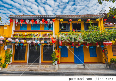 facade of an ancient Asian house decorated with colorful hanging Chinese lanterns for holiday in the old town in Hoi An in Vietnam facade of an ancient Asian house decorated with colorful hanging Chinese lanterns for holiday in the old town in Hoi An in Vietnam 118893463