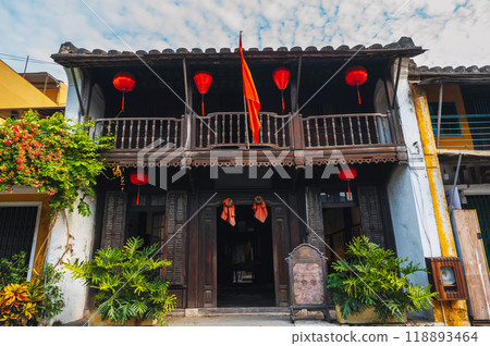 facade of an ancient Asian house decorated with hanging Chinese lanterns for holiday in old town in Hoi An in Vietnam 118893464
