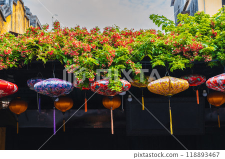 Colorful Chinese lanterns decorate the wall of a traditional Asian house for Chinese New Year holiday in Asia in Hoi an in day 118893467