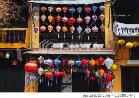 colorful silk Chinese lanterns decorate the wall of traditional Asian house for the Chinese New Year holiday in Asia 118893473