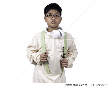 Portrait of boy in casual clothes carry a green bag and white headphones isolated on a white background, The concept of education and way of life. Cute boy posing in casual clothes with clipping part. 118893853