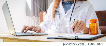 Doctor records health examination results and medication usage of patient, healthcare and medical checkup concept. 118893875